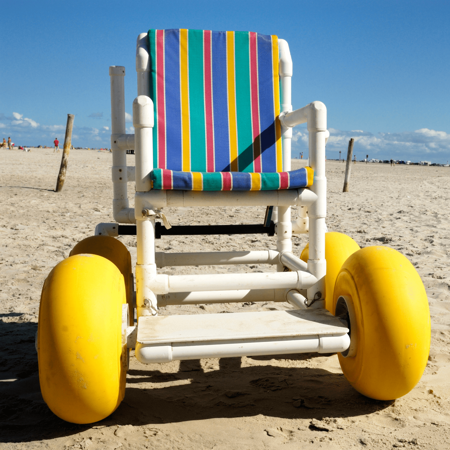 Beach wheelchair on a sandy beach.