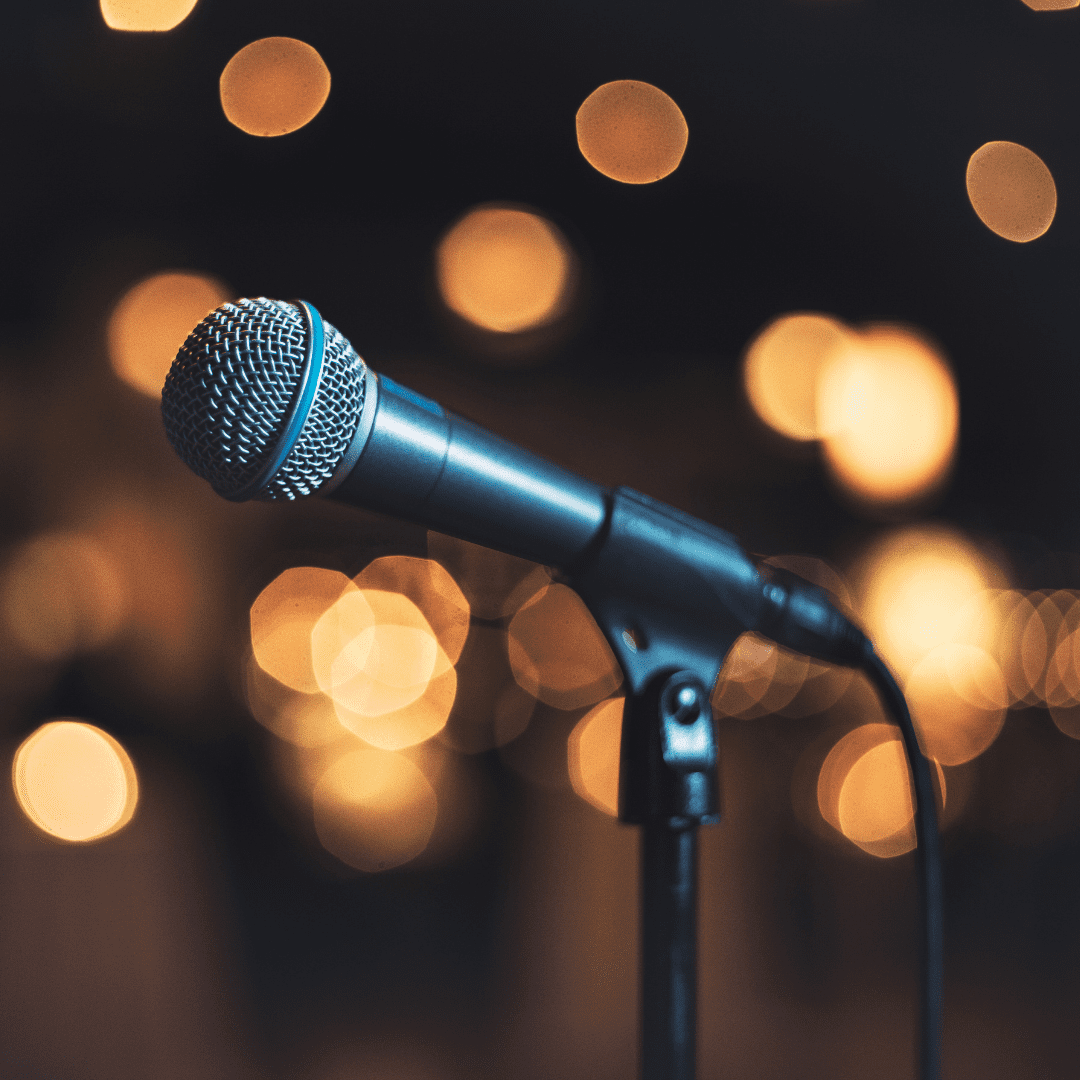 Microphone with lights in the background.