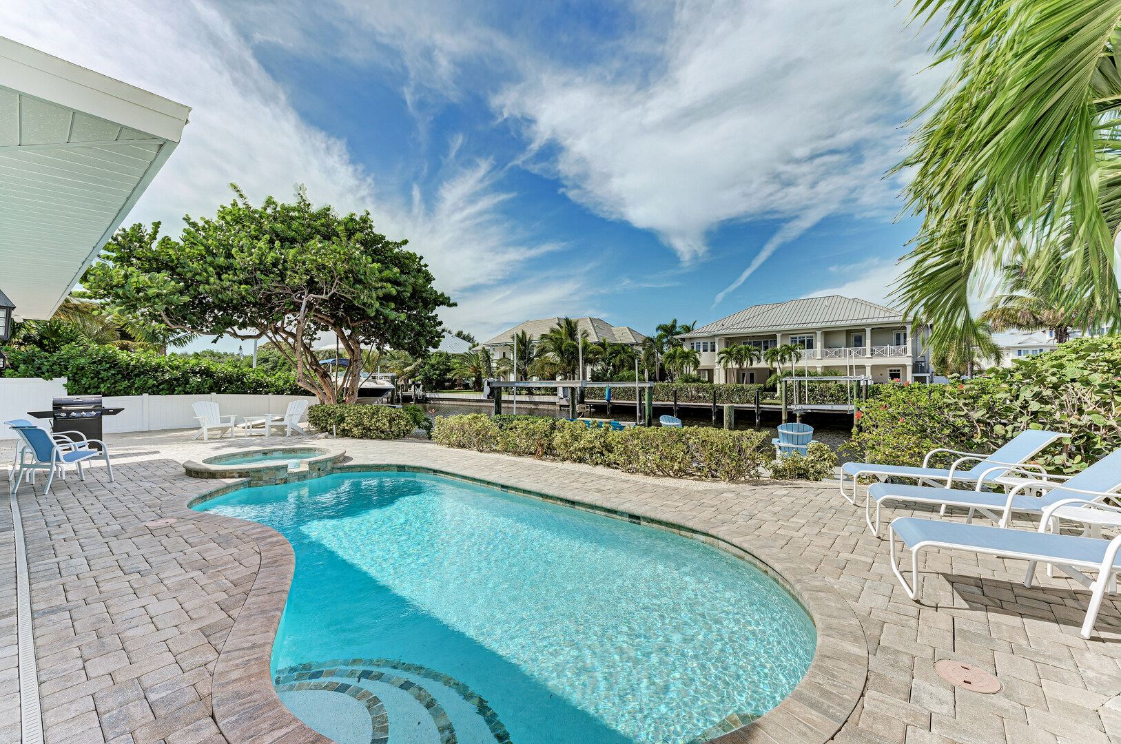 Pool overlooking the canal at Lazy Lagoon by Anna Maria Life Vacation Rentals