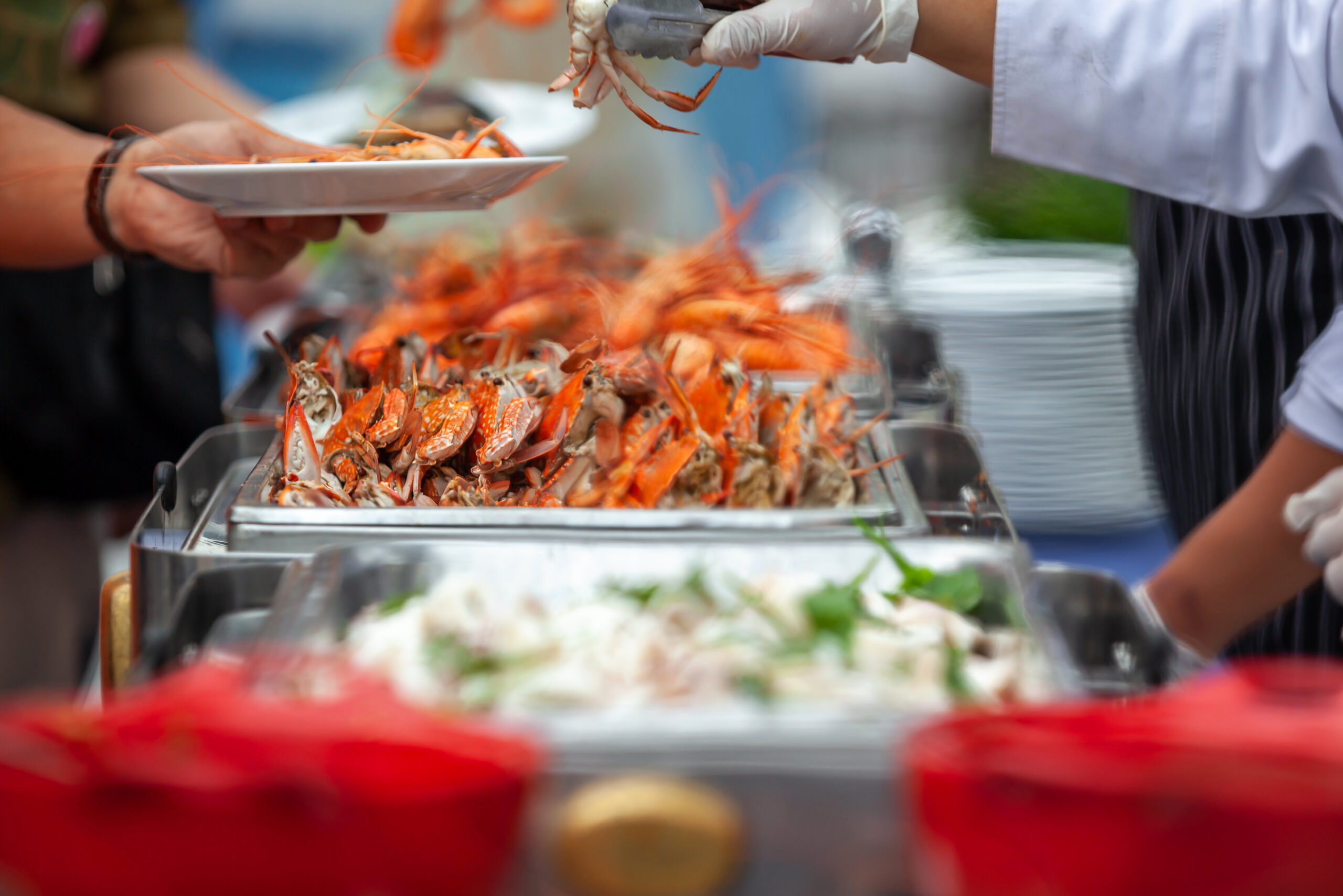 Chef waiter grill crab and shrimps dish menu serving for guests