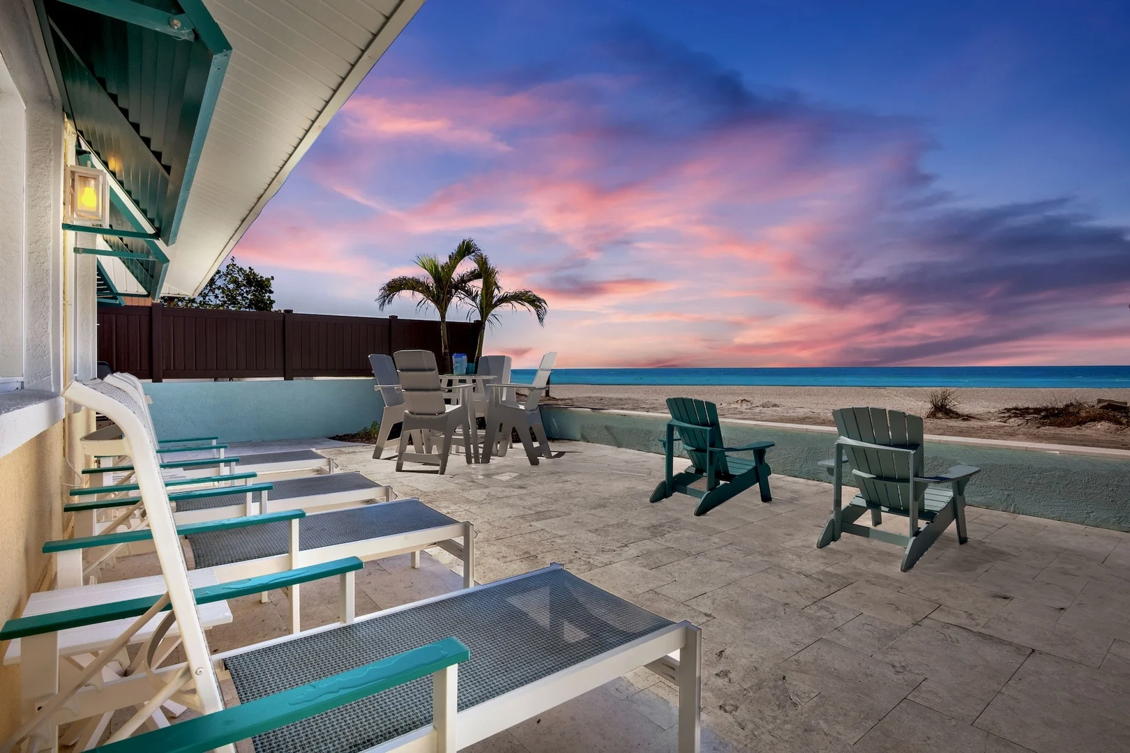 Beachfront yard with sand at sunset